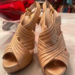 Prada nude vanilla shoes 4 inches 36.5. There is some scuffs pictured.